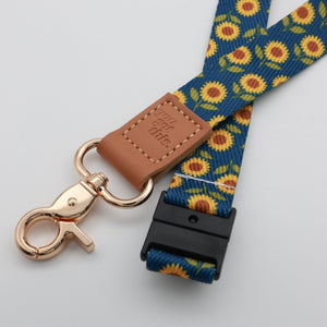 You Got This embossed on a navy sunflower lanyard with brown trim and a lobster clasp.
