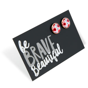 Floral earrings on a card with 'be BRAVE Beautiful' text