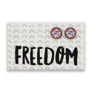 Earrings with floral design on a card with 'FREEDOM' text