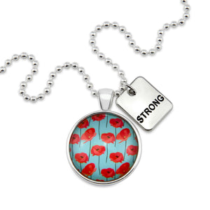 Necklace with pendant featuring red poppies and a 'STRONG' tag on a white background