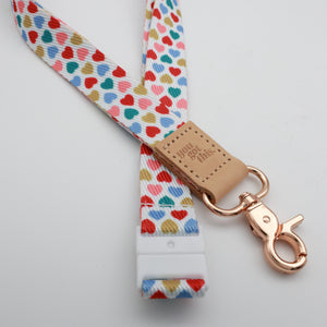 You Got This embossed on a white lanyard with multicoloured hearts and tan trim and a lobster clasp.