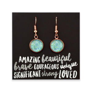 Teal paisley print rose gold dangle earrings on amazing inspiring word card on white background.