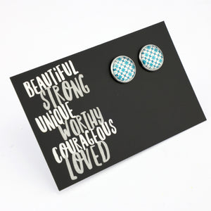 Teal print silver stud earrings on beautiful inspiring word card on white background.