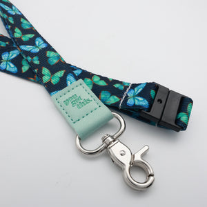 You Got This embossed on a navy lanyard with teal butterflies and mint trim and a lobster clasp.