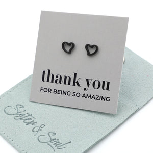 Heart-shaped earrings on a 'thank you' card with 'Sister & Soul' branding.