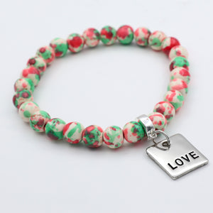 Beaded bracelet with a 'LOVE' charm on a white background