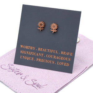 Rose gold sunflower earrings on a dark card with motivational text, displayed on a purple fabric background.