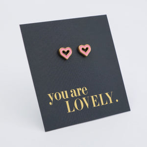 Heart-shaped earrings on a card with 'You are Lovely' text