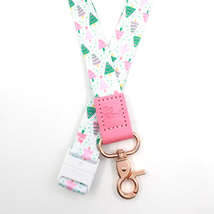 Christmas Delight lanyard with colourful Christmas trees, a pink Be Kind tab, gold-tone clasp and white breakaway fastening.