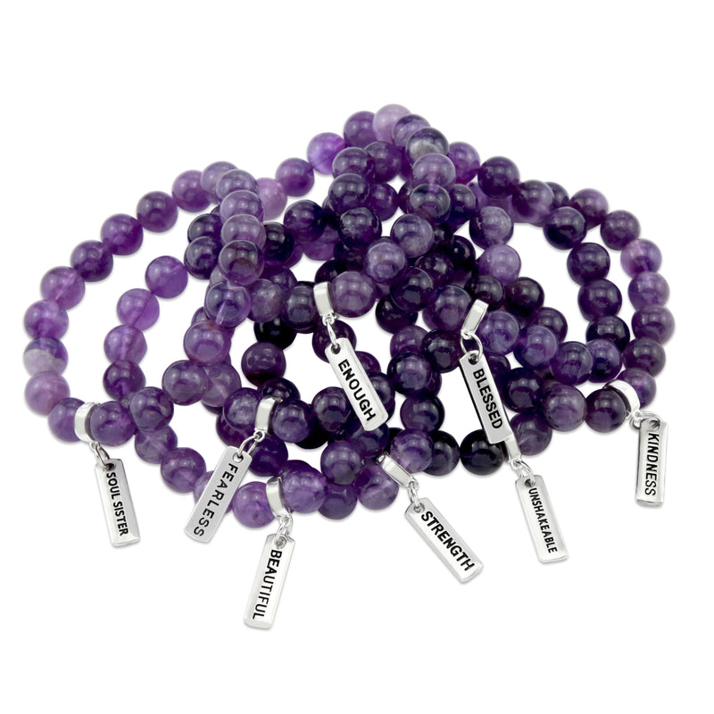 Amethyst stone bead bracelet with charm featuring the word strength and silver clip. 
