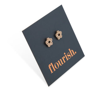 Flower Power studs in rose gold stainless steel on a foil flourish card.