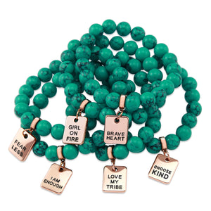 Teal coloured stone bracelet with word charm and rose goldclip.