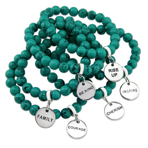 Teal coloured stone bead bracelet with silver meaningful word charm.