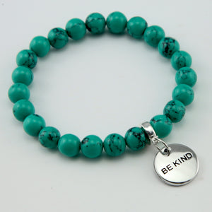 Teal coloured stone bead bracelet with silver meaningful word charm.