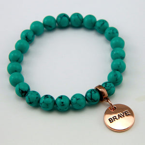 Teal coloured stone bead bracelet with rose gold charm
