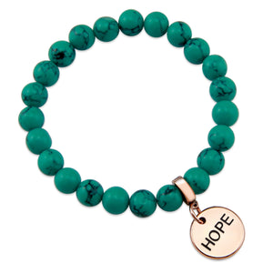Teal coloured stone bead bracelet with rose gold charm