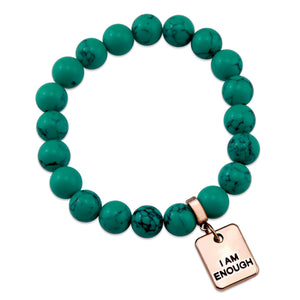 Teal coloured stone bracelet with word charm and rose gold clip.
