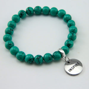 Teal coloured stone bead bracelet with silver meaningful word charm.