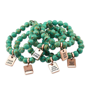 Teal coloured stone bead bracelet with rose gold word charm.