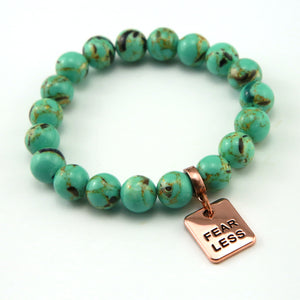Teal coloured stone bead bracelet with rose gold word charm.