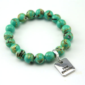 Teal coloured stone bead bracelet with meaningful word charm.