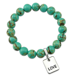 Teal coloured stone bead bracelet with meaningful word charm.