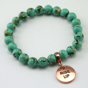 Light teal stone bead bracelet with rose gold meaningful word charm.