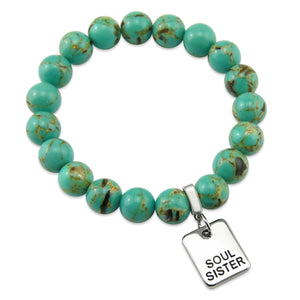 Teal coloured stone bead bracelet with meaningful word charm.