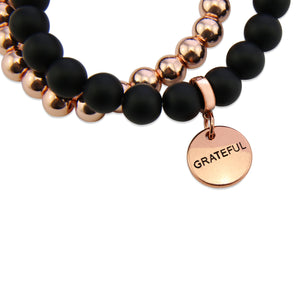 Stone Bead Bracelet Duo. Matt Black Onyx stone with rose gold clip and GRATEFUL word charm with rose gold hematite stacker bracelet.