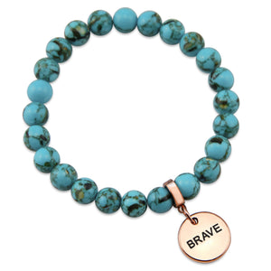 Teal coloured stone bracelet with word charm and rose gold clip.