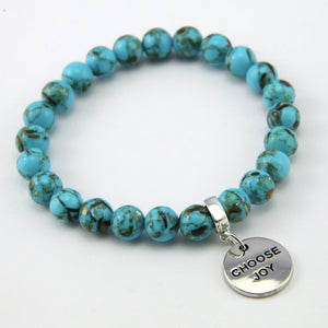 Teal coloured stone bracelet with word charm and silver clip.