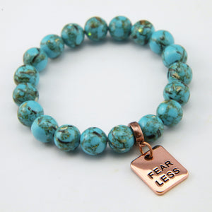 Teal coloured stone bracelet with word charm and rose gold clip.