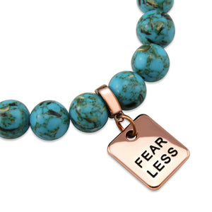 Teal coloured stone bracelet with word charm and rose gold clip.