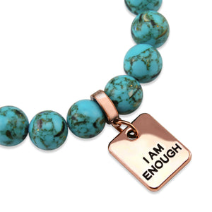 Teal coloured stone bracelet with word charm and rose gold clip.