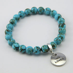 Teal coloured stone bracelet with word charm and silver clip.