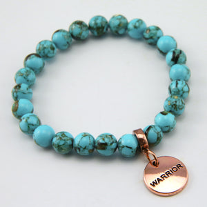 Teal coloured stone bracelet with word charm and rose gold clip.