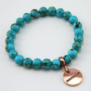 Teal coloured stone bracelet with word charm and rose gold clip.
