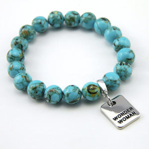 Teal coloured stone bracelet with word charm and silve r clip.