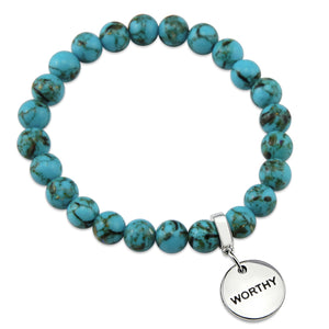 Teal coloured stone bracelet with word charm and silver clip.