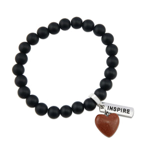 Matt black onyx stone bead bracelet with copper sparkle sandstone heart charm and inspiring word charms in silver.