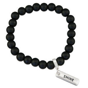 Black onyx stone bead bracelet with silver meaningful charm.