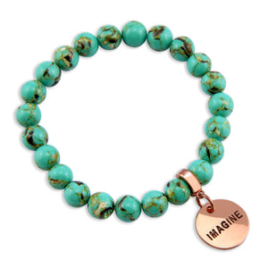 Light teal stone bead bracelet with rose gold meaningful word charm.