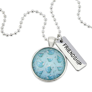 Teal tea cup print pendant necklace in bright silver with friendship charm.