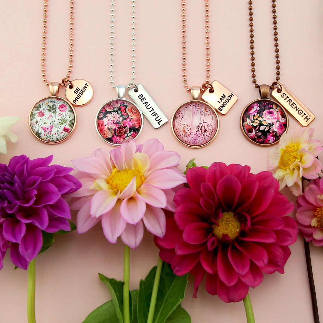 Pink flowers and background with pendant necklaces. Fundraiser for the National Breast Cancer Foundation. 