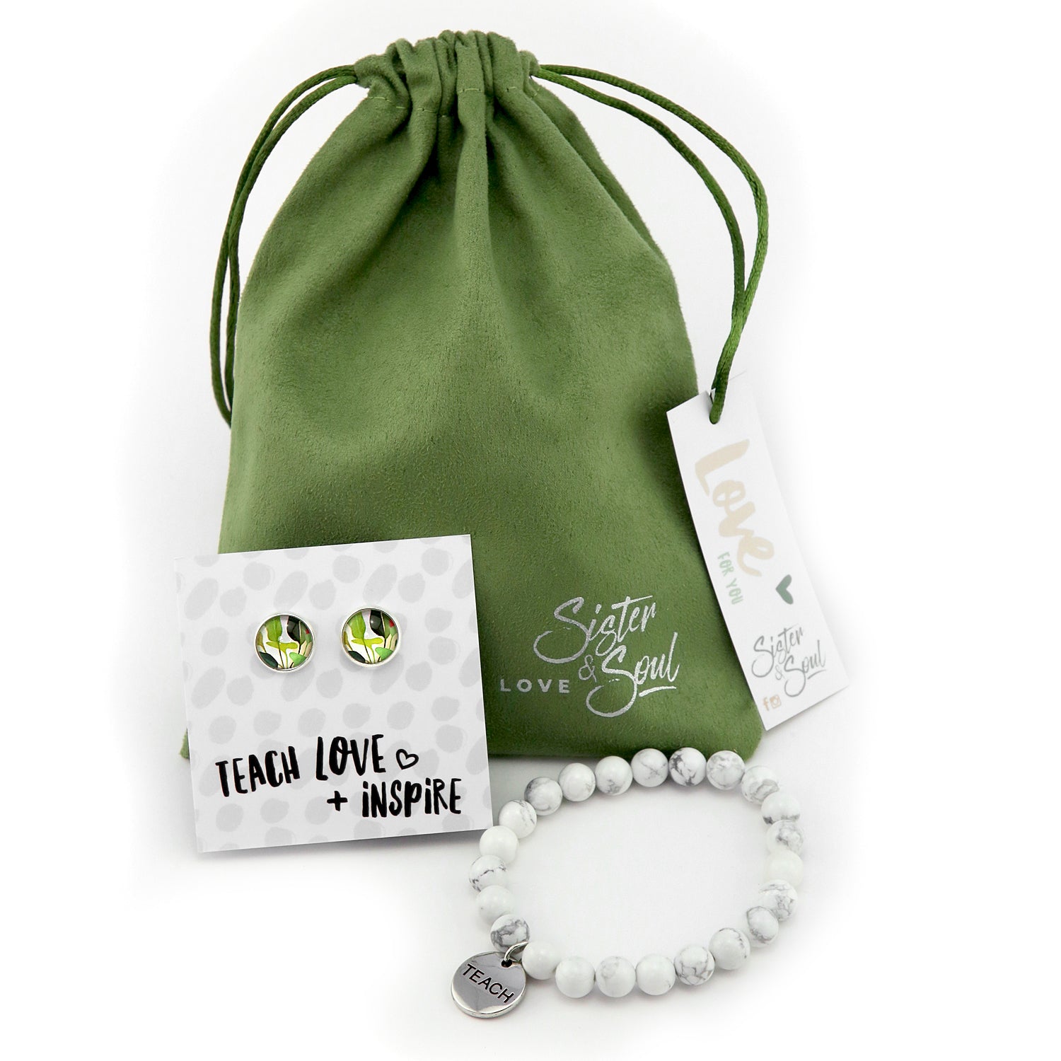 Jewelry set with earrings and bracelet on a white background, featuring a green drawstring bag and white flowers.
