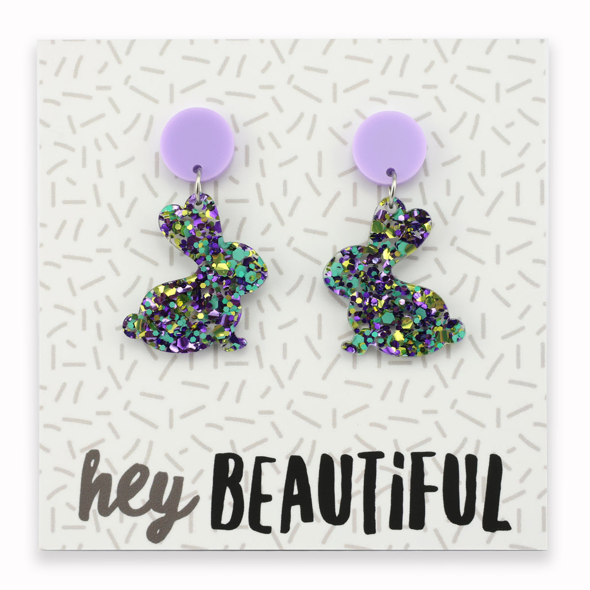 A pair of colorful acrylic bunny-shaped earrings on a card with 'hey beautiful' text.