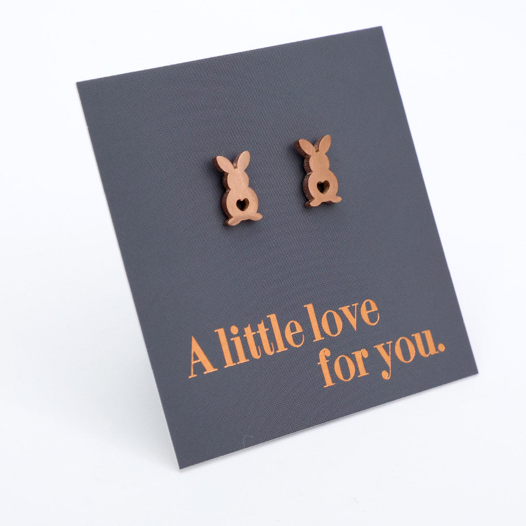 Bunny-shaped earrings on a card with 'A little love for you' text