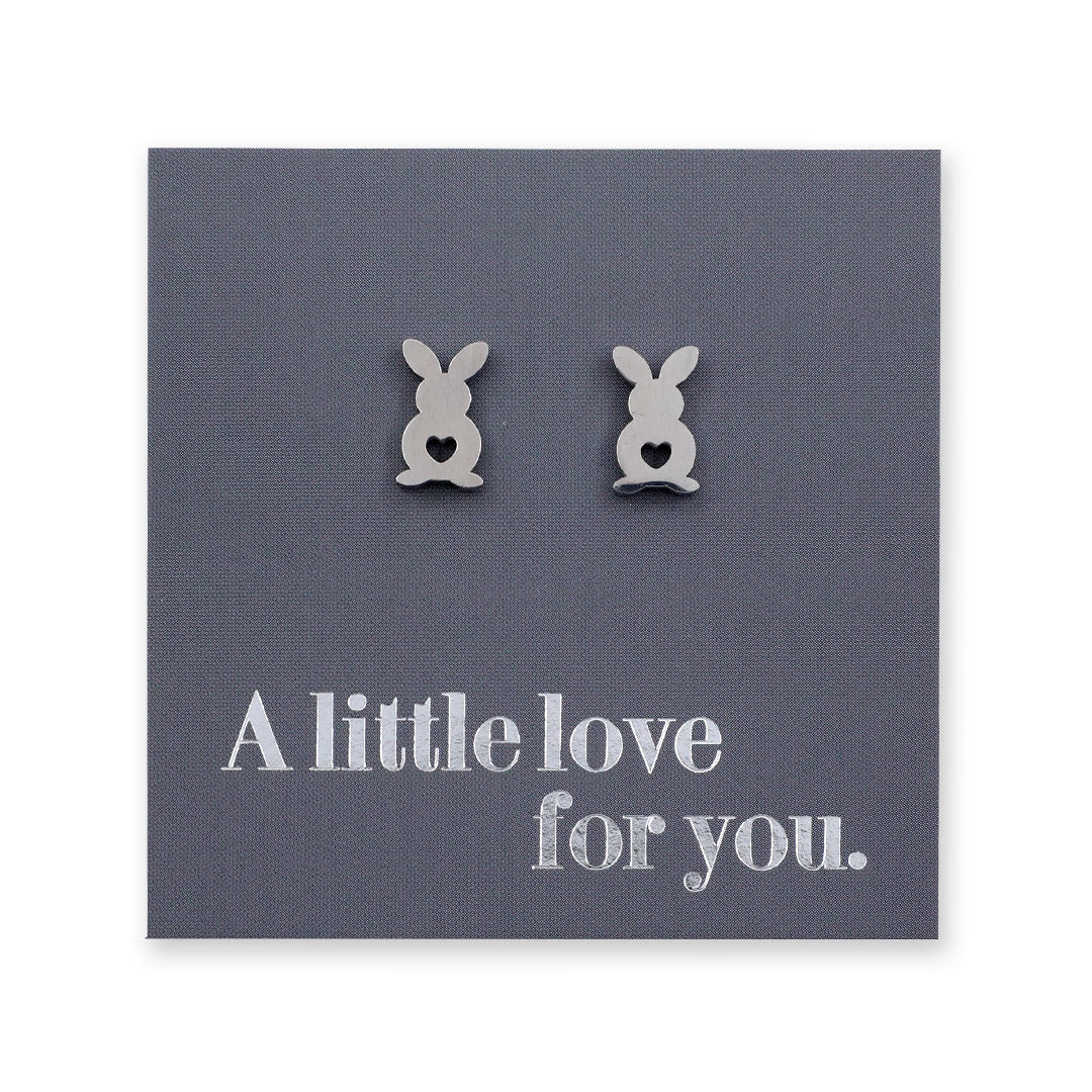 Bunny-shaped earrings on a card with 'A little love for you.' text
