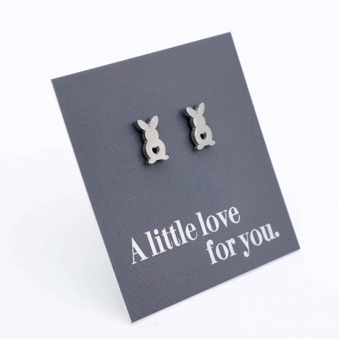 Pair of bunny-shaped earrings on a card with 'A little love for you' text.
