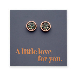 Pair of round earrings on a gray card with 'A little love for you.' text